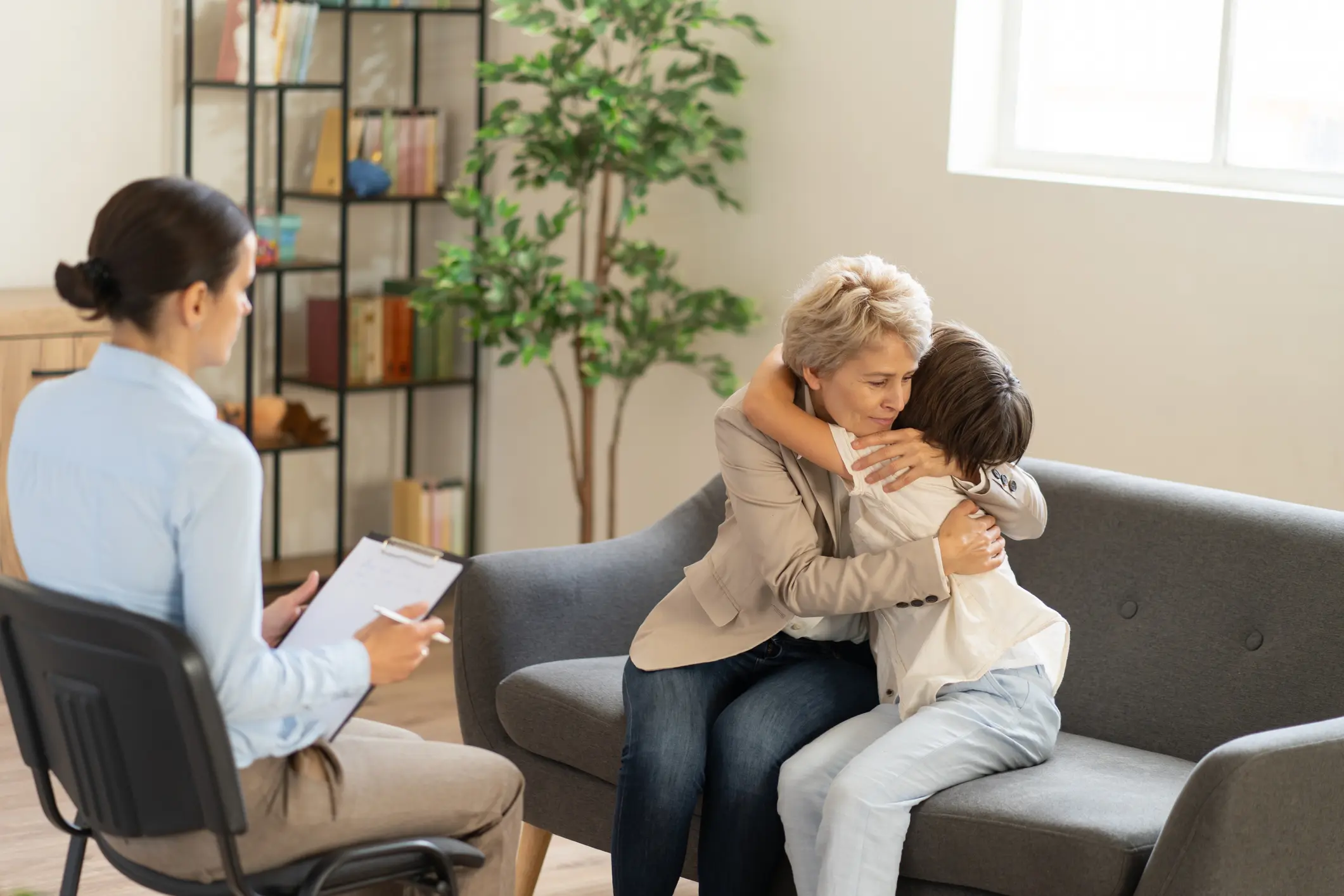 Therapy session with comforting hug.